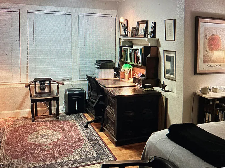 Large Professional Desk in bedroom with King Size Bed.