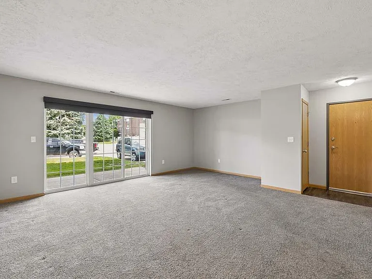 A bright, open living area with generous natural light creates a welcoming space to relax, gather, and feel right at home.