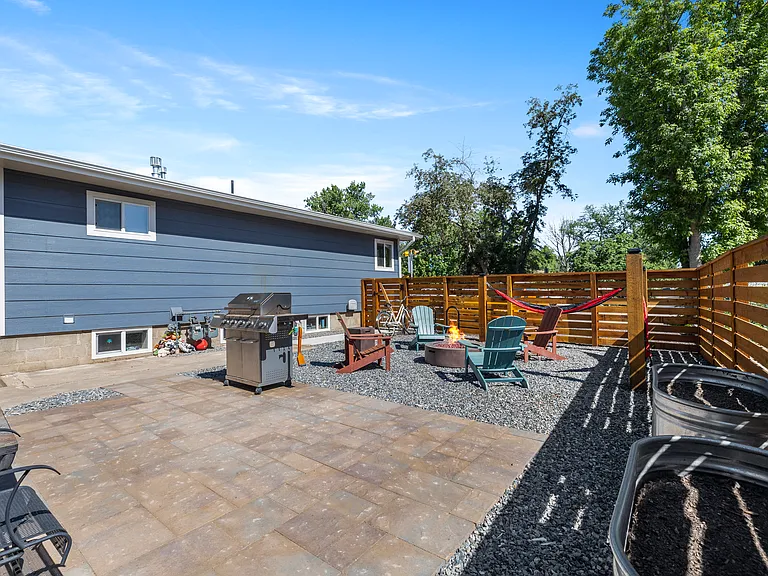 View of private fenced-in area looking at the house
