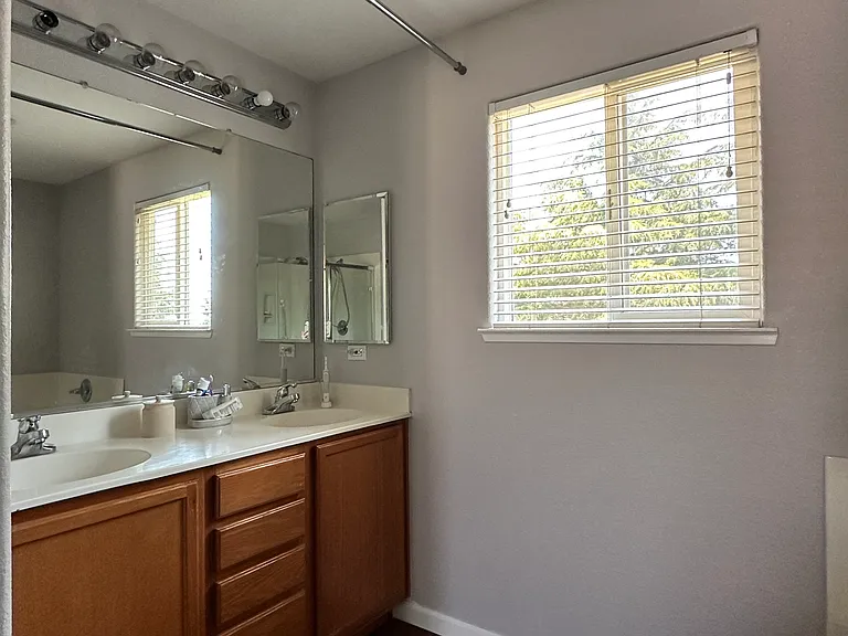 Large bathroom connected to large bedroom