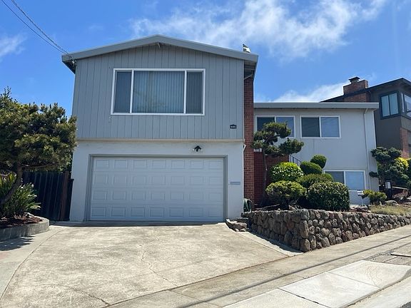 Front of house has amazing landscaped yard