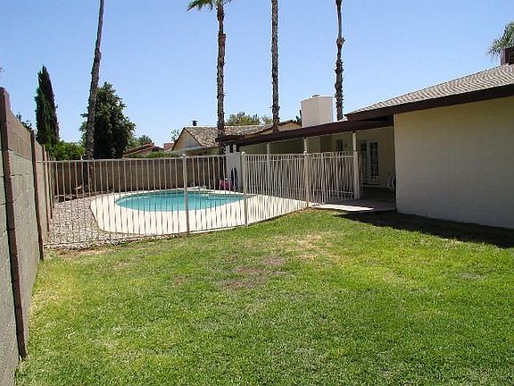 Fenced pool and yard area.