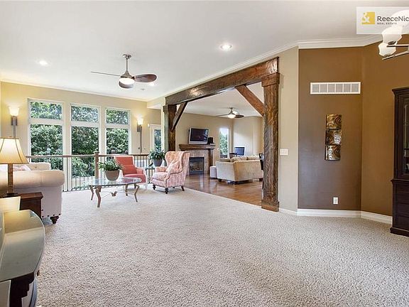 Welcome, This beautiful open concept home with custome beams and windows that follow the stair case down to lower level.  Bringing in the view of the protected forever woods.  How relaxing.