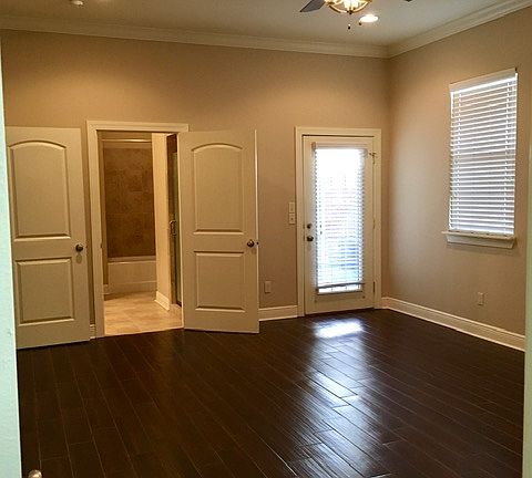 Master Bedroom with access to private patio and over size walk in closet.