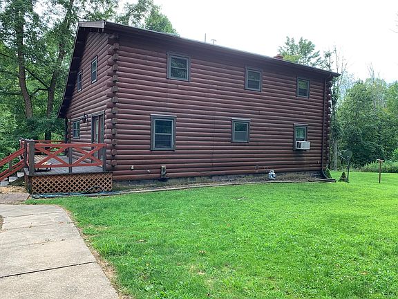 Back view of home with side deck