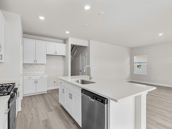 The well-appointed kitchen features plenty of counter space to make meal prep a breeze.
