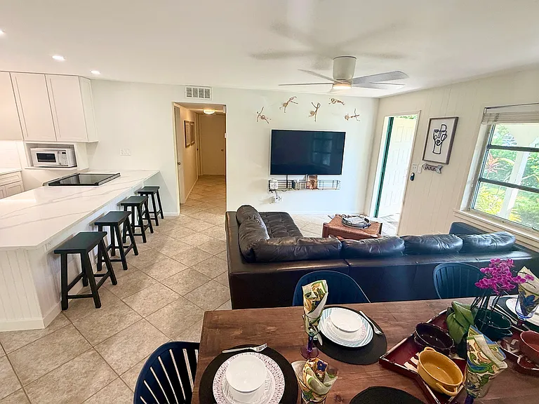 OPEN CONCEPT LIVING / DINING/ KITCHEN AREA 

Complete with sofa and table for 6 & 65-inch 4K UHD Roku Smart TV

The kitchen is equipped with stainless steel appliances & stocked with cooking essentials, pots, pans, microwave, & drip coffee maker