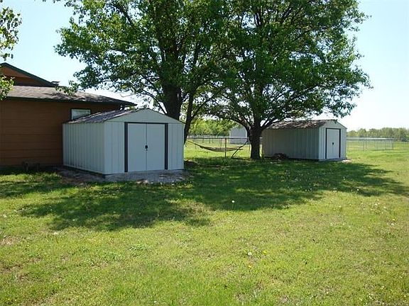 2 storage sheds to help keep clutter out of your garage!