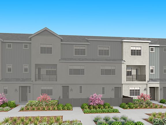 The image depicts a multi-story residential building with a gray exterior, surrounded by landscaped