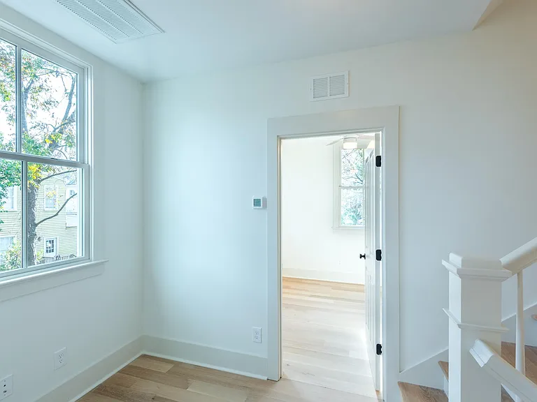 After walking up to the second floor, you come to a landing with a bedroom on either side. The landing provides great space for a desk or sitting area!