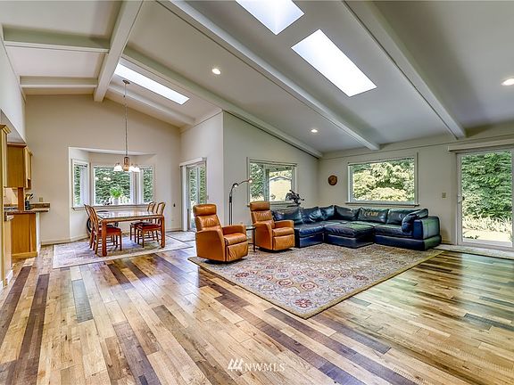 Great room with vaulted ceilings and skylights.  Private setting with ample natural light.