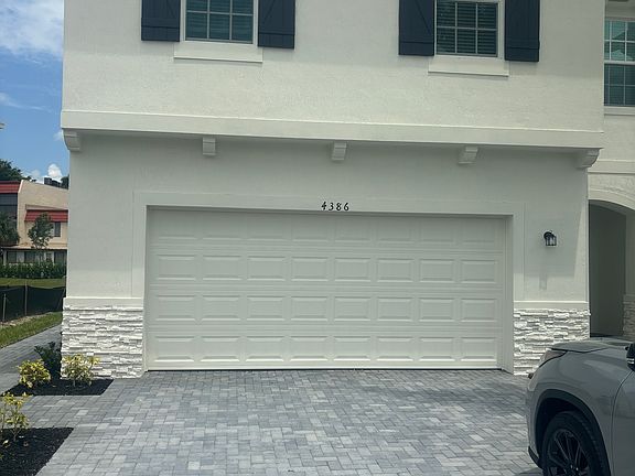 Conner unit with 2 car garage, large driveway with space sufficient for 4 more cars