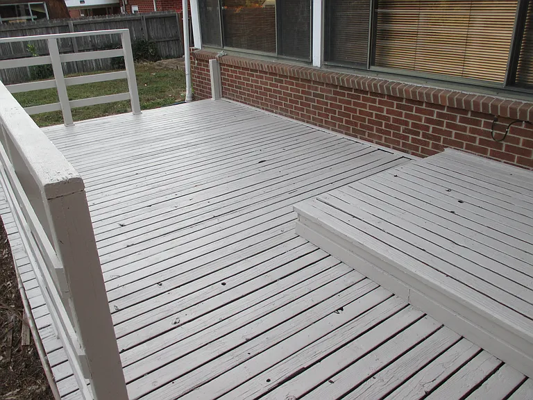 Large deck off enclosed patio.