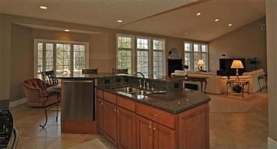 Kitchen comes fully-applianced with granite countertops.