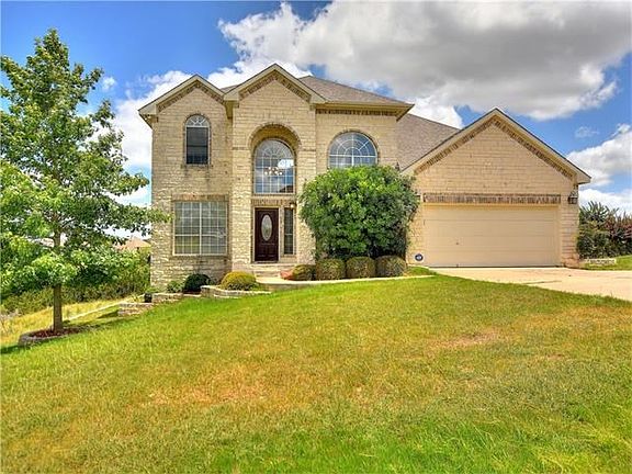 Beautiful home with large two car garage situated on one acre lot.