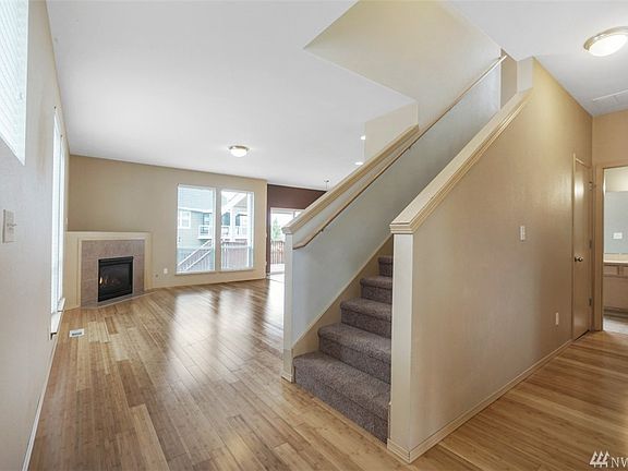 Half bath to the right, as well as garage access. Open concept living