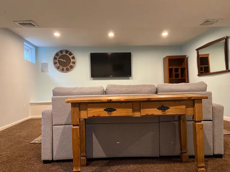 Fully furnished with new couch, tables, and many other nice pieces of furniture throughout the apartment.