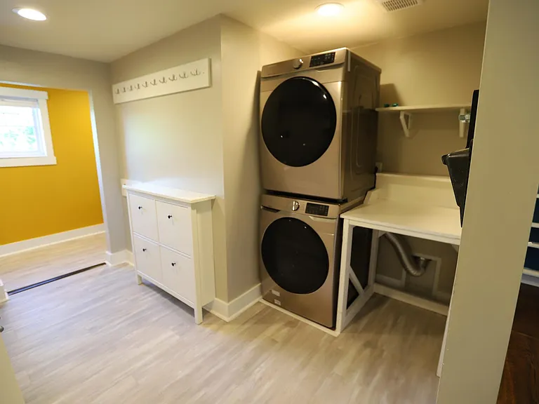 Laundry/utility room. New washer/dryer in 2019. Large laundry table stays with home.