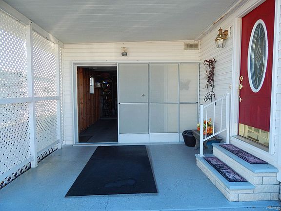 covered driveway with a garage