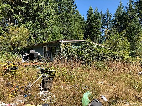 Lot is actually quite level and all the utilities are in and functional.  Just needs some clearing and TLC.