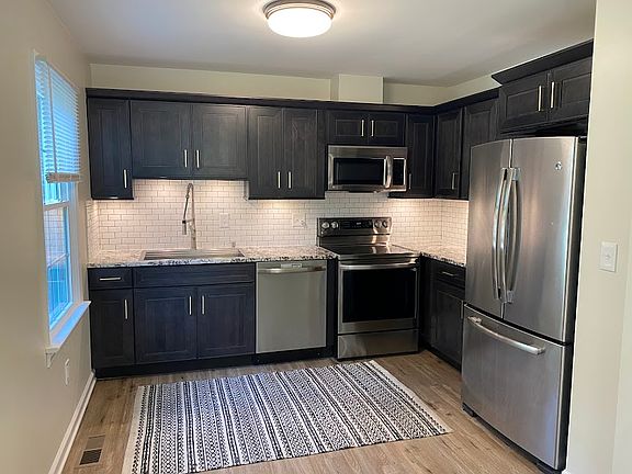 Updated Kitchen with range, dishwasher, fridge and microwave