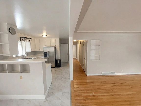 Living room meets our beautiful white kitchen.