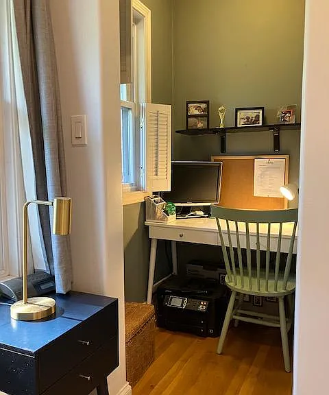 Office nook off the back bedroom. Easy to set up for a view out the window and background privacy.