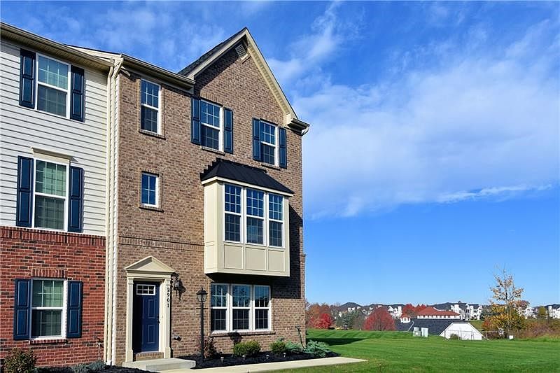 The large side yard is the property of this unit!  This immaculate end-unit is the desirable Wexford model which is very spaciou
