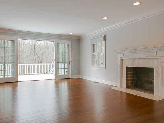 Living room with fireplace and French doors