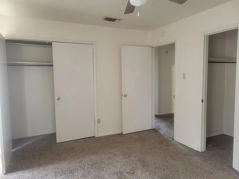 Master bedroom showing 2 large closets