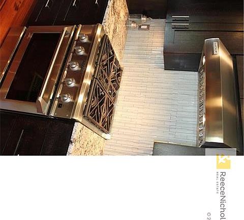 Custom Quarter sawn oak Kitchen cabinets w/ soft close drawers - Designer glass tile back splash - Canaan installed Granite countertops & Stainless steel Sink. - Delta touch2O faucet - GE Monogram duel fuel oven - Wolf Range hood - Miele dishwasher- Samsu