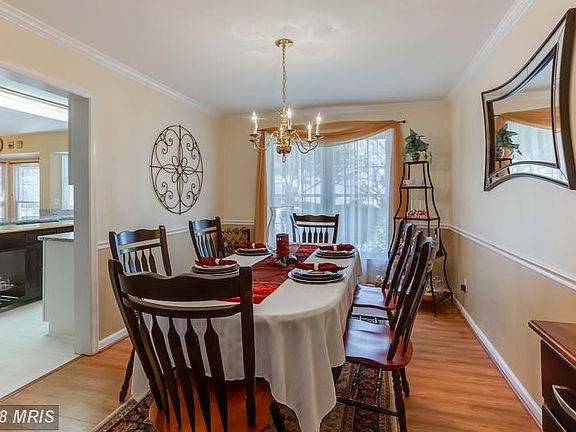 Dining Room w/ Crown Molding and Chair Railing