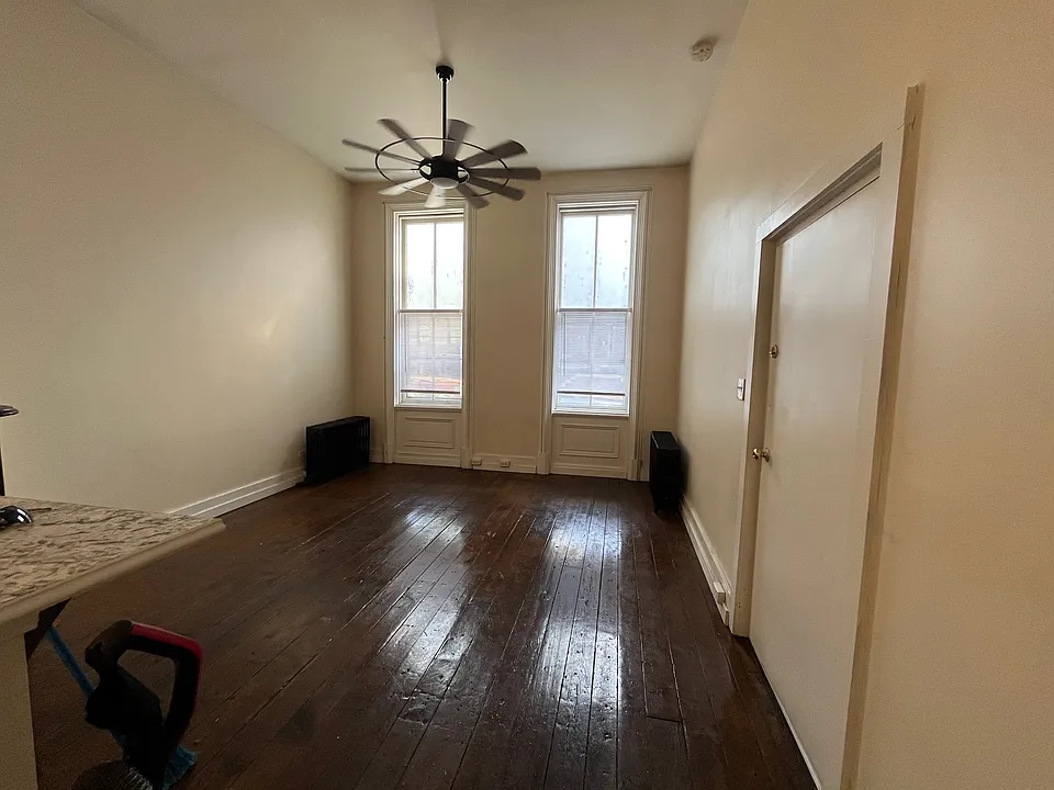 refinished hardwood floors . super tall windows