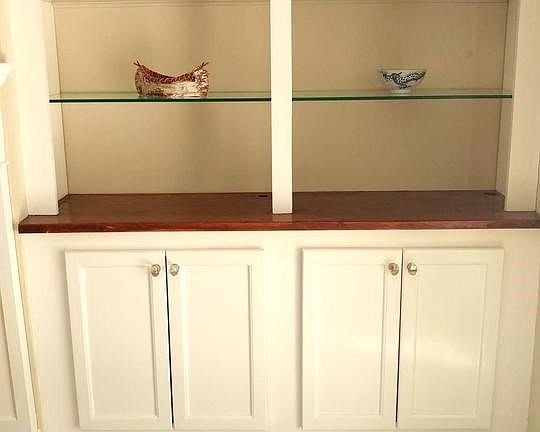 Custom built bookcase with glass shelves