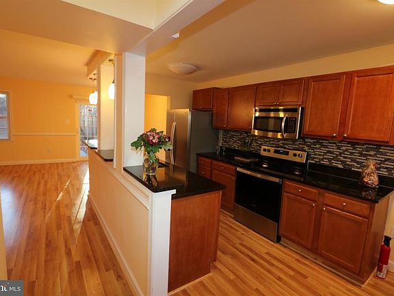 Open and remodeled kitchen with granite countertops and stainless steel appliances