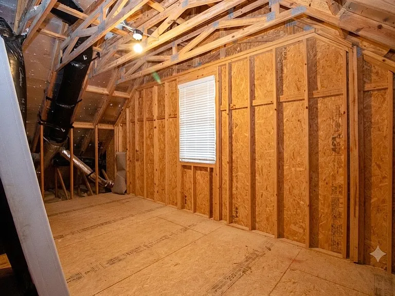 Walk in attic with lock and key for added storage and security if needed.