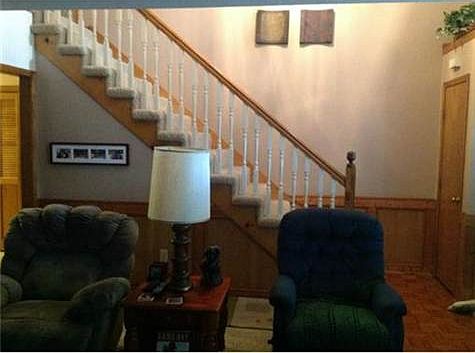 Open Stairway from Foyer and Living Room.
