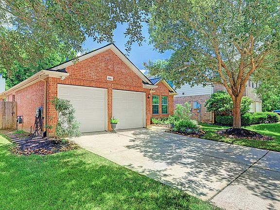 This home is gorgeous inside and out! Large shade trees in the front yard shade a double wide driveway and covered entry.