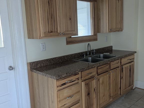 Hickory cabinets & stainless steel sink