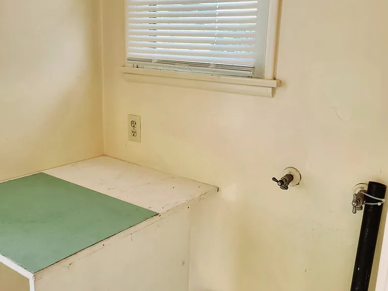 Laundry hookup and folding table for your towels