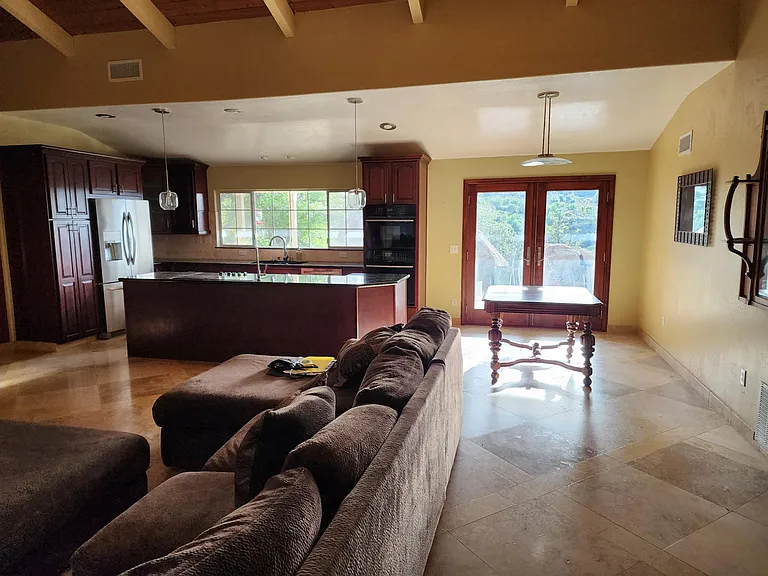 Open concept living room, kitchen and dining area