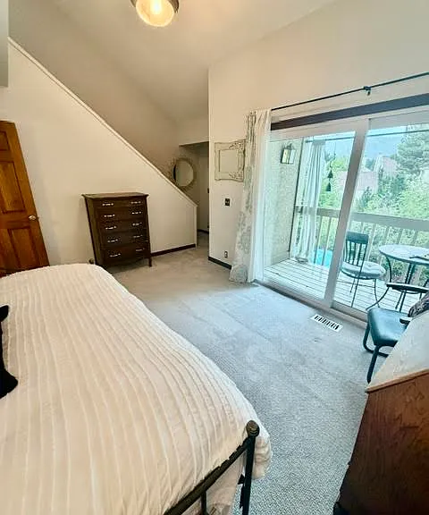 Second Story Bedroom with a Trundle Bed that goes from a Twin to a King Bed and a balcony with views of Park City Mountain Resort.
