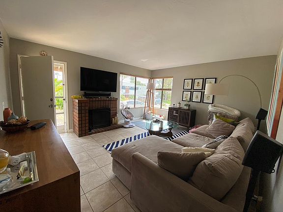 Living room, looking toward street, with fireplace