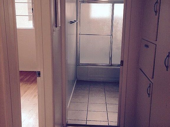 Hallway to bathroom and bedr