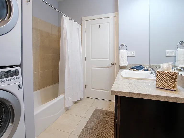 Bathroom with view of bath tub (features double shower head)
