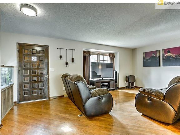Spacious great room with wood floors.