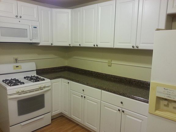 Kitchen counter, gas stove, and microwave