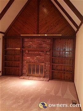 Living Room with fireplace and bookshelves