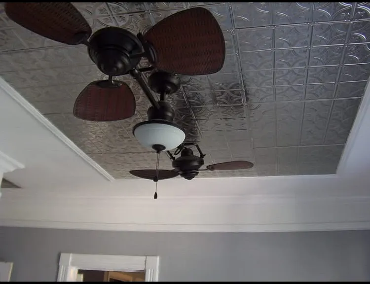 tin ceiling with double ceiling fan and light fixture