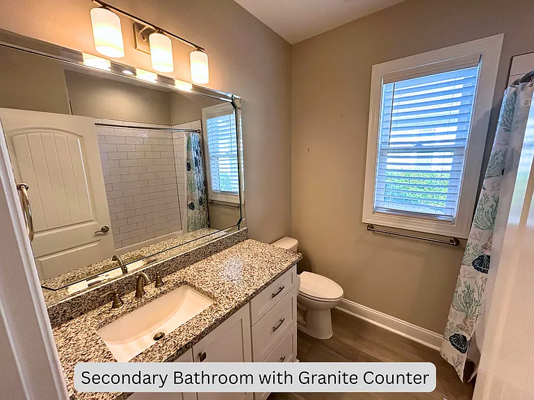 Secondary bathroom with granite counter